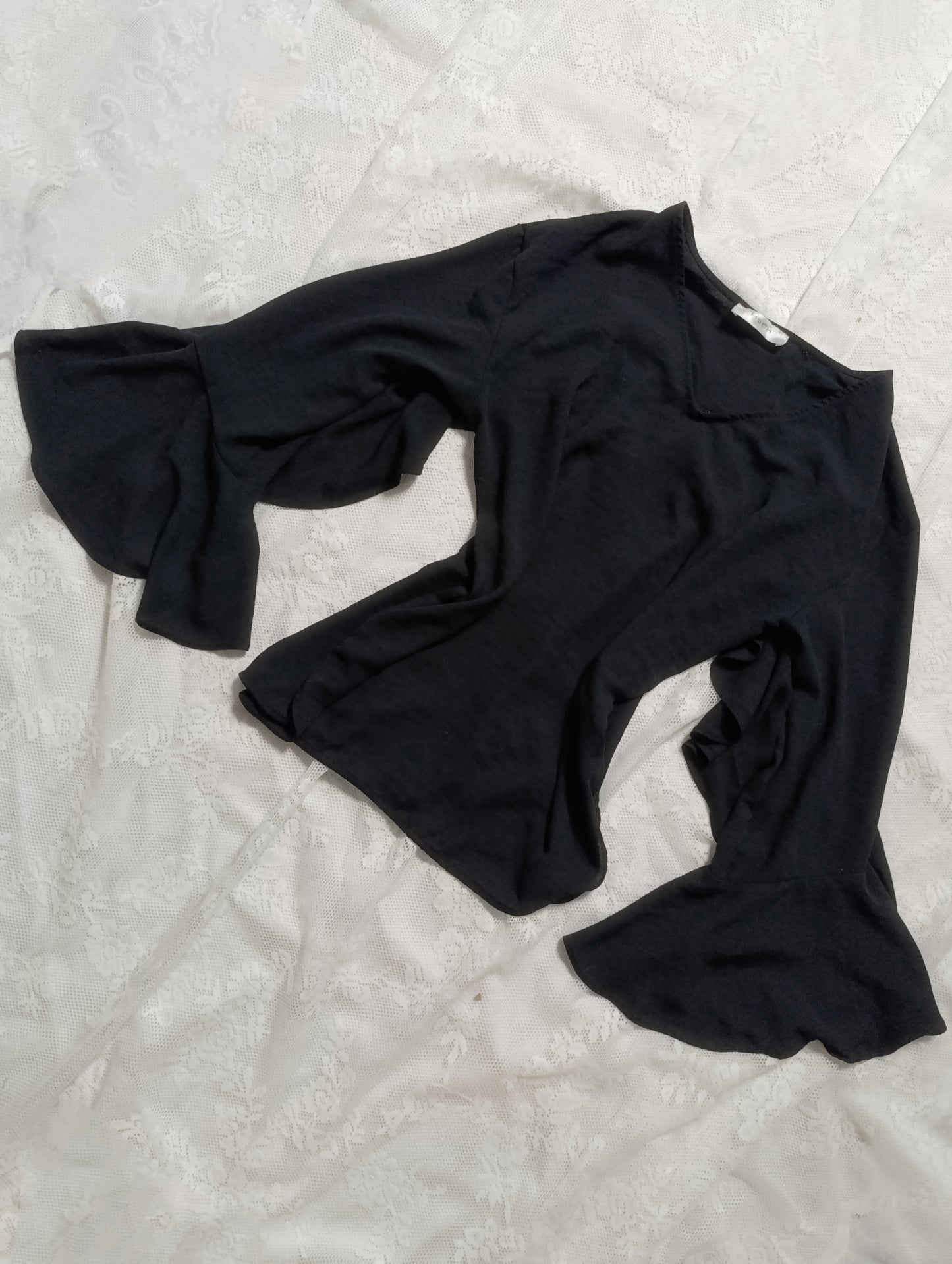 Black blouse with wide sleeves and ruffles
