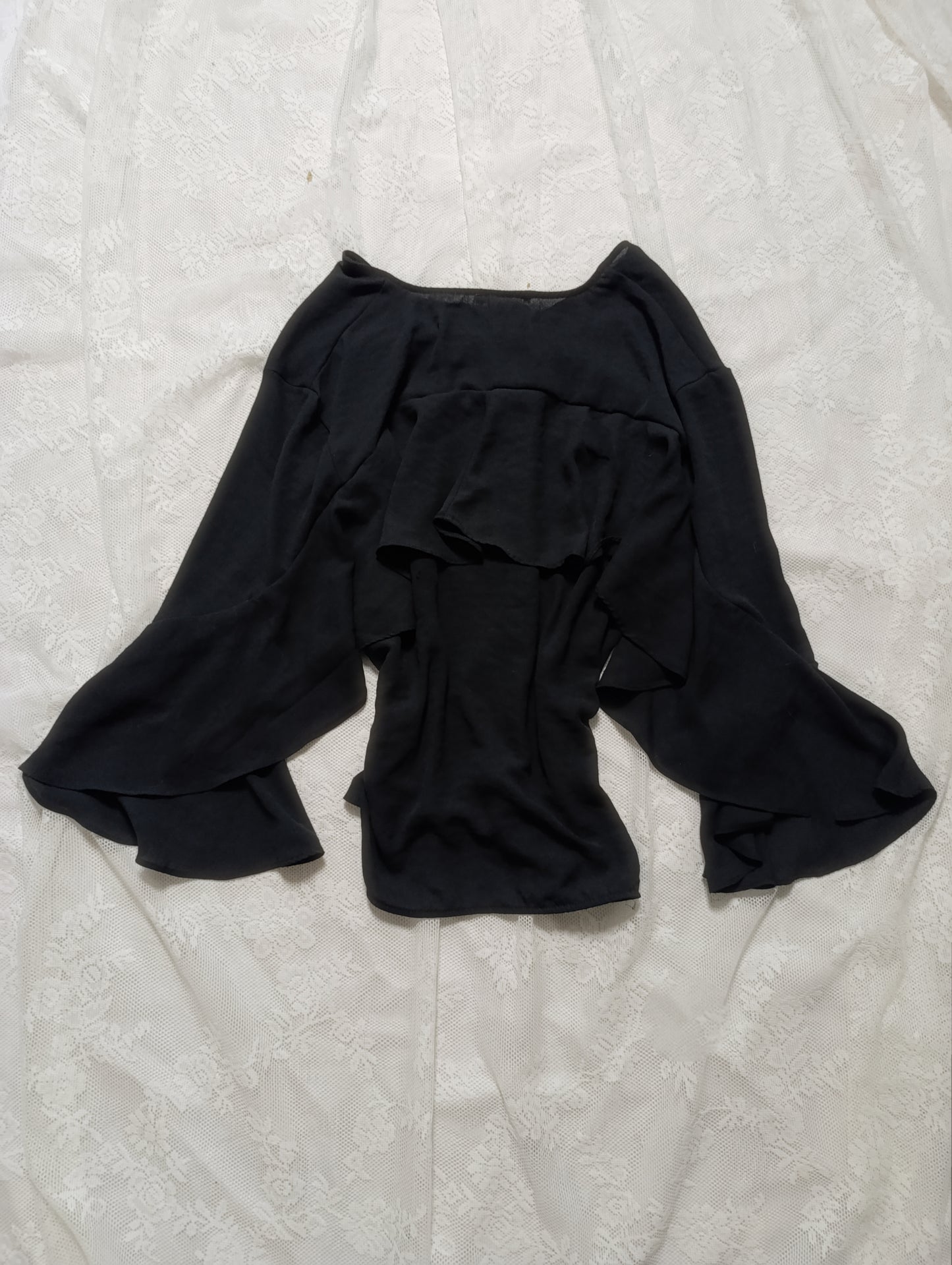 Black blouse with wide sleeves and ruffles