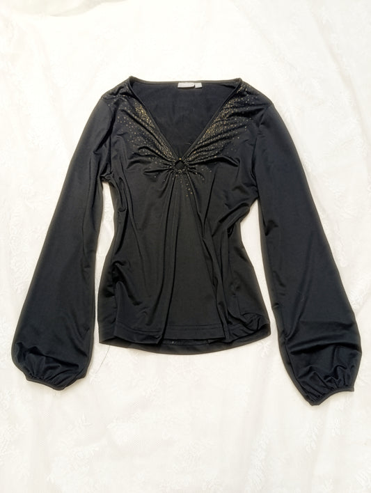 Blouse with glitter details and metal ring